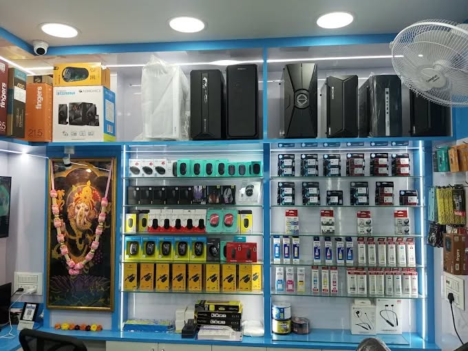 Shelves of computer parts, speakers and accessories at Lokenath Infotech
